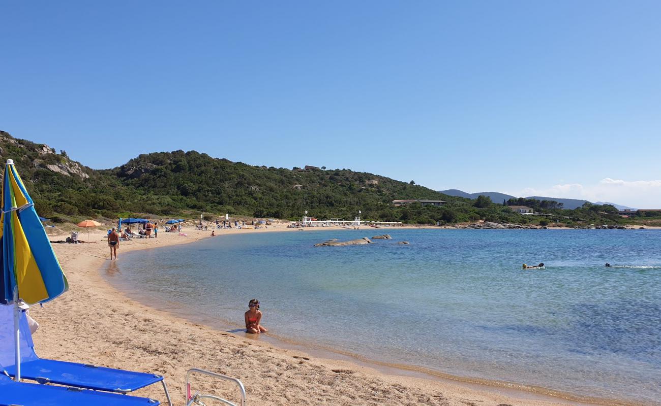 Photo of Spiaggia Su Sarrale with brown sand surface