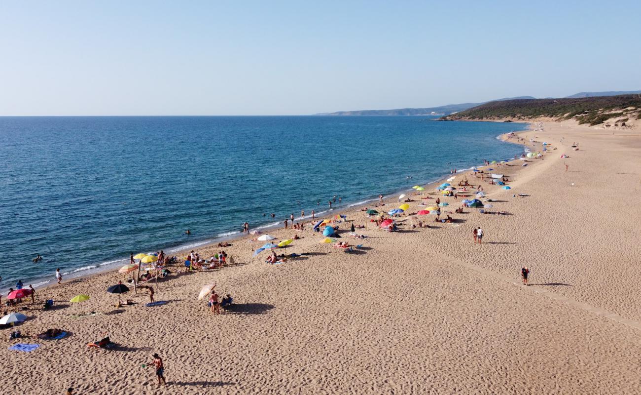 Photo of Piscinas Beach with bright fine sand surface