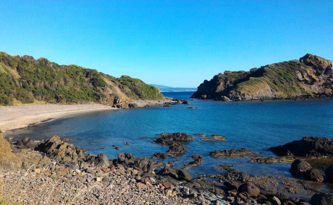 Photo of Porto Managu beach with rocks cover surface