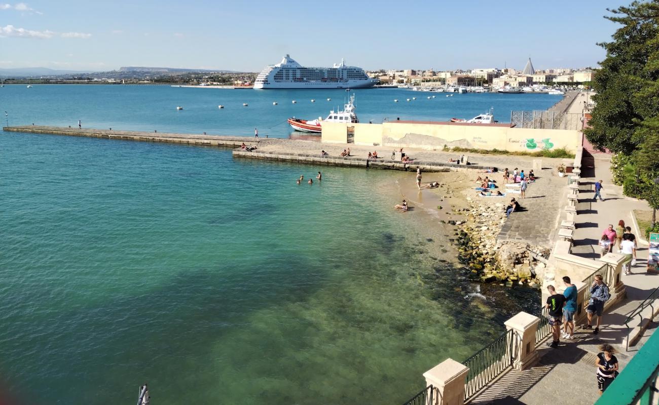 Photo of Spiaggetta della Marina in Ortigia with bright sand surface