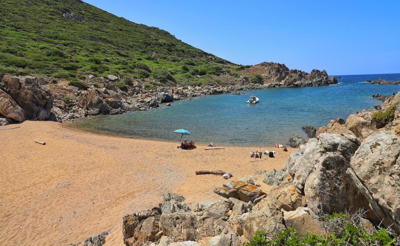 Photo of Spiaggia di Cala Faa with bright sand surface