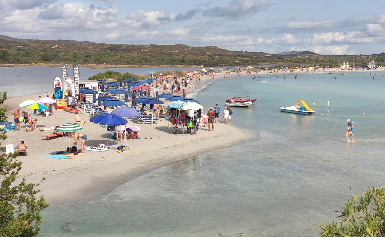 Photo of Spiaggia Lu Postu with bright sand surface