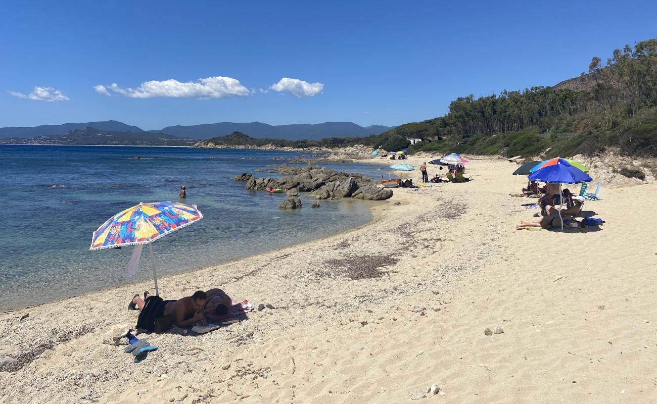 Photo of Spiaggia di Perda S'Acchiloni with bright sand & rocks surface