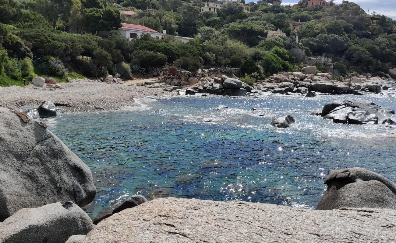 Photo of Caletta di Baccu Mandara with gray pebble surface