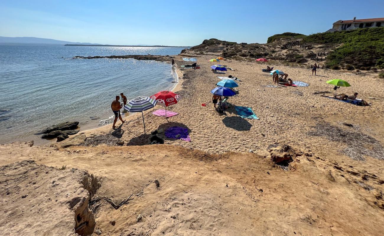 Photo of Spiaggia Su Pallosu with bright sand surface