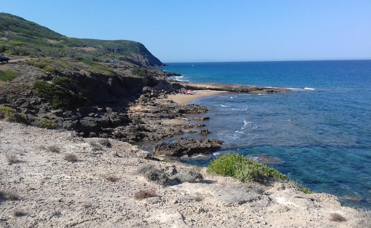 Photo of Cala dello Scoglio Rosso with rocks cover surface