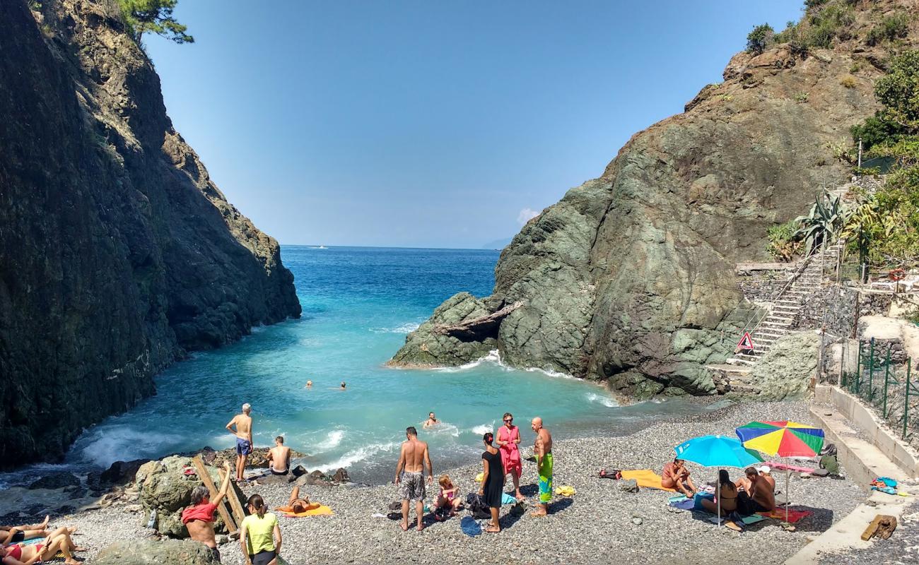 Photo of Spiaggia di Porto Pidocchio with gray pebble surface