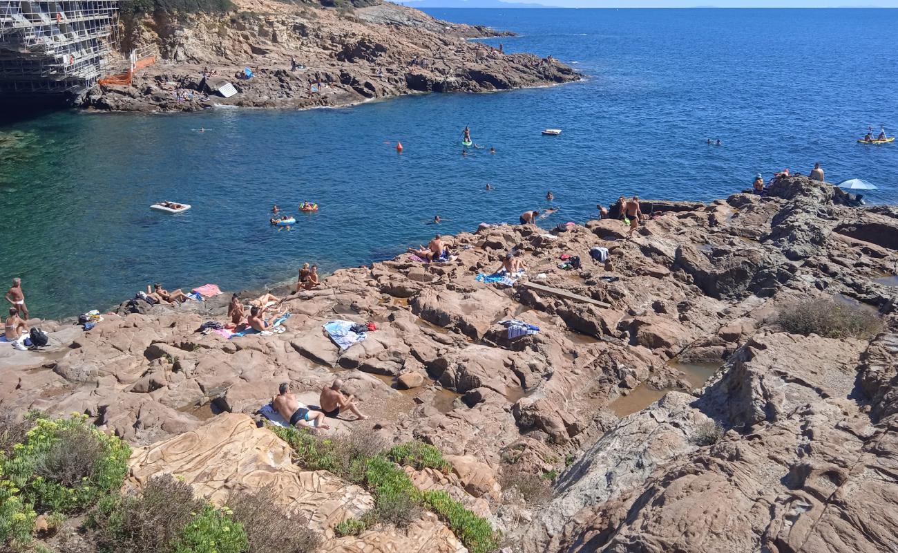 Photo of Spiaggia di Calafuria with rocks cover surface