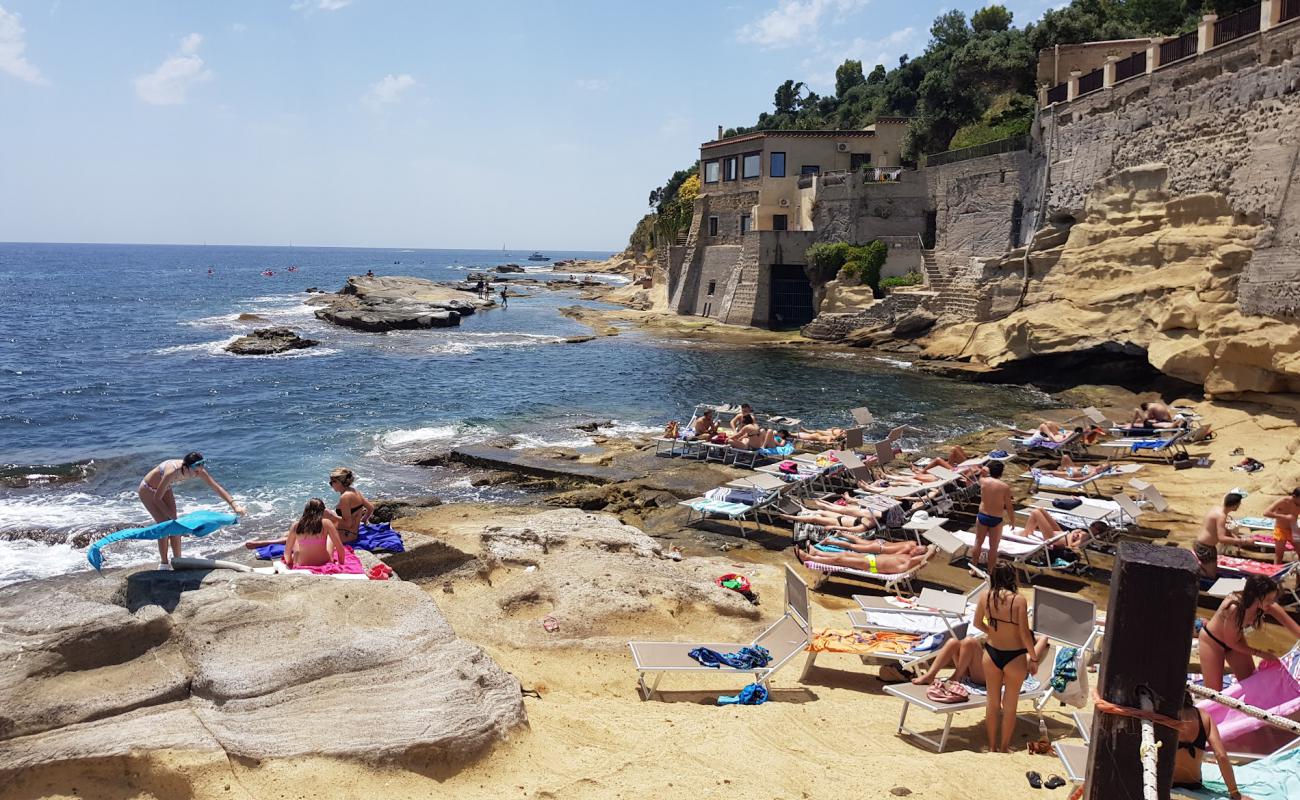 Photo of Baia delle Rocce Verdi with rocks cover surface