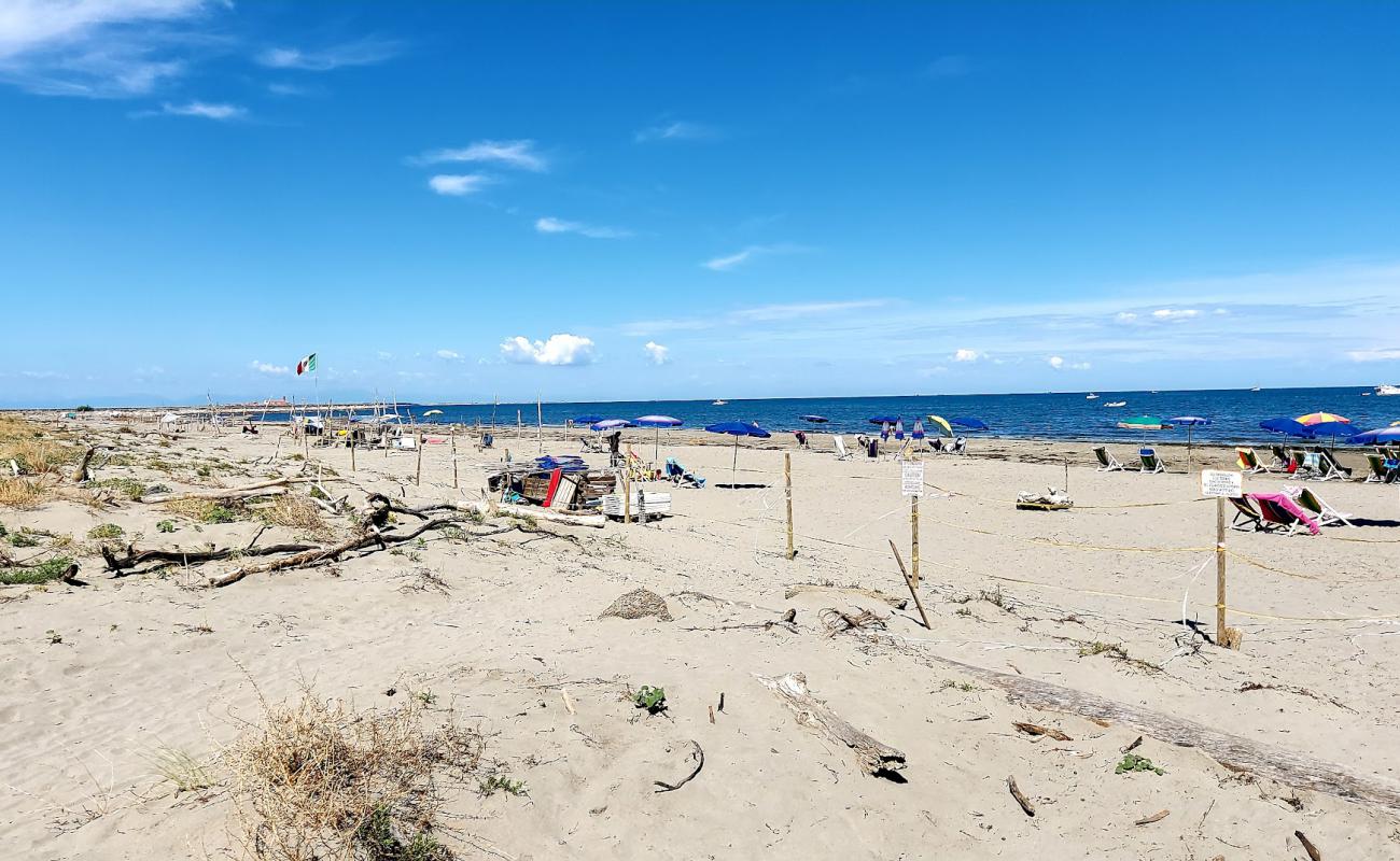 Photo of Spiaggia di Ca Roman with bright sand surface