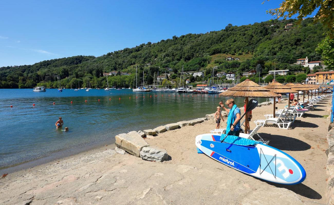 Photo of Spiaggia Solcio di Lesa with gray sand &  pebble surface