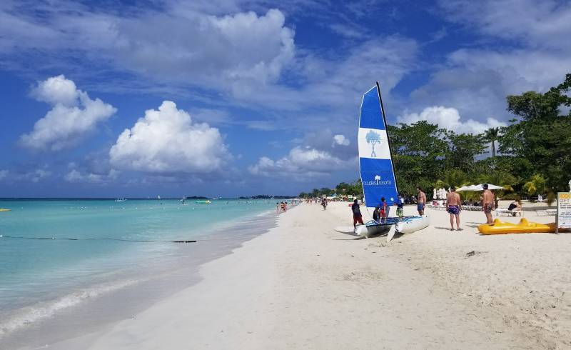 Photo of Seven Mile Beach with white fine sand surface