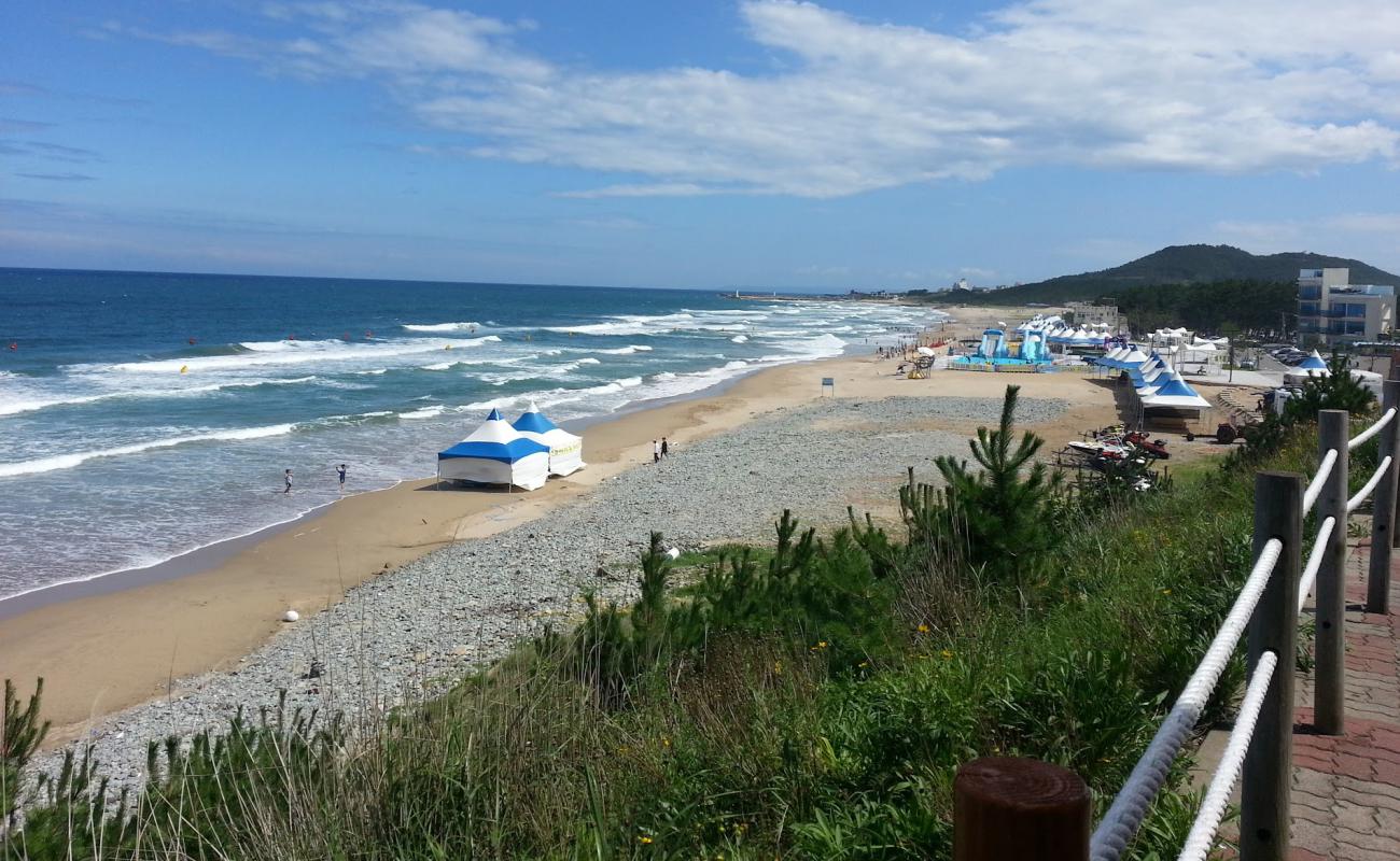 Photo of Hwajin Beach with bright sand surface