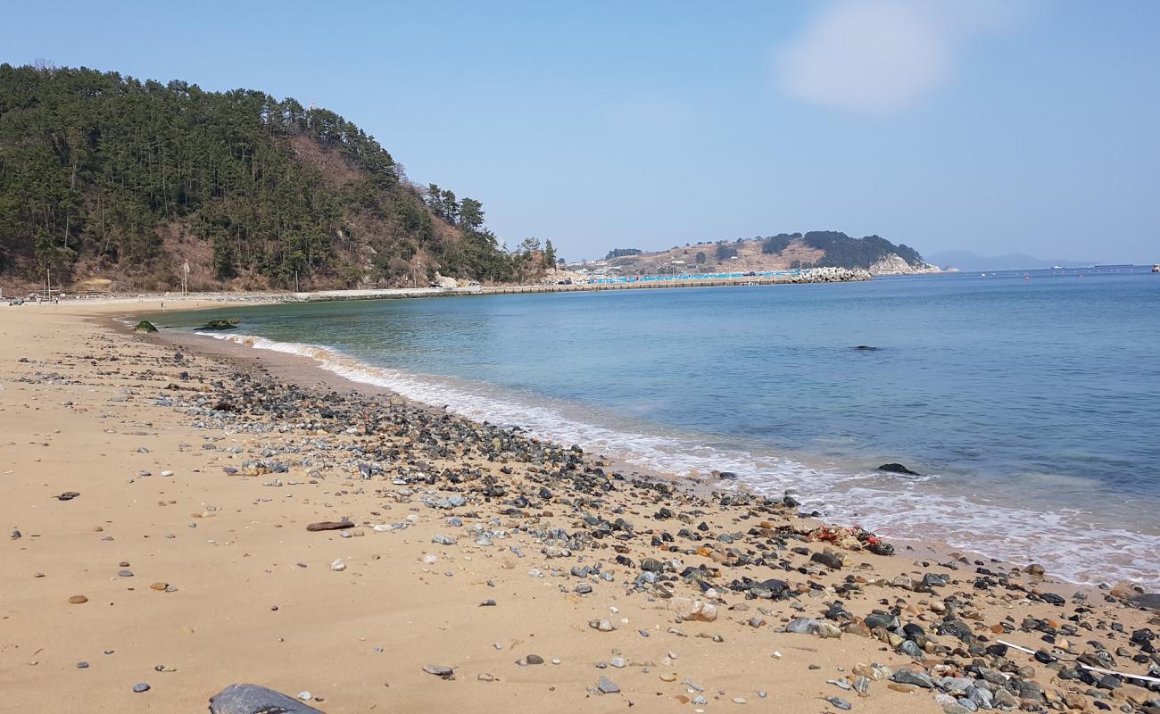 Photo of Heungnam Beach with bright sand & rocks surface