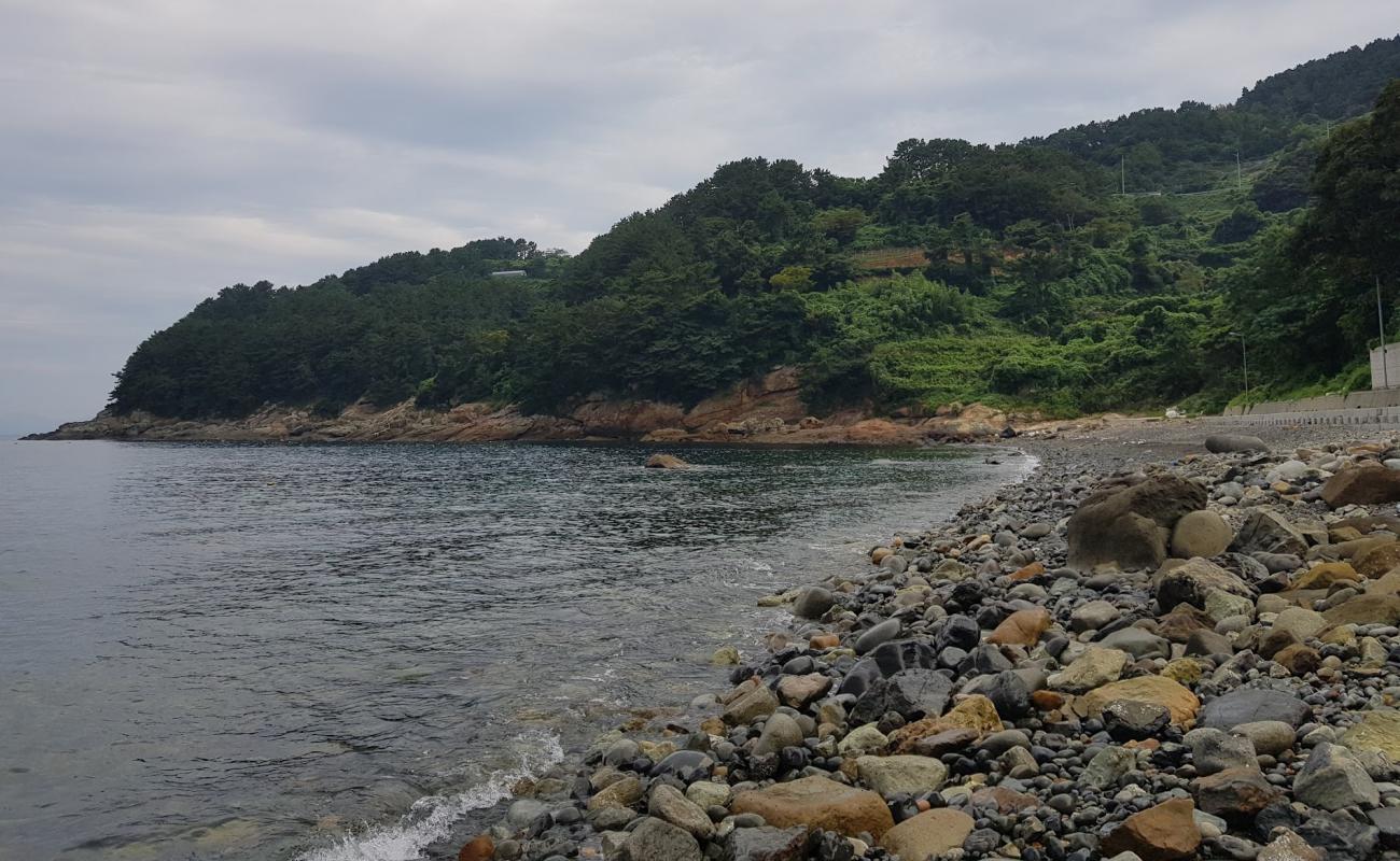 Photo of Dodong Beach with gray pebble surface