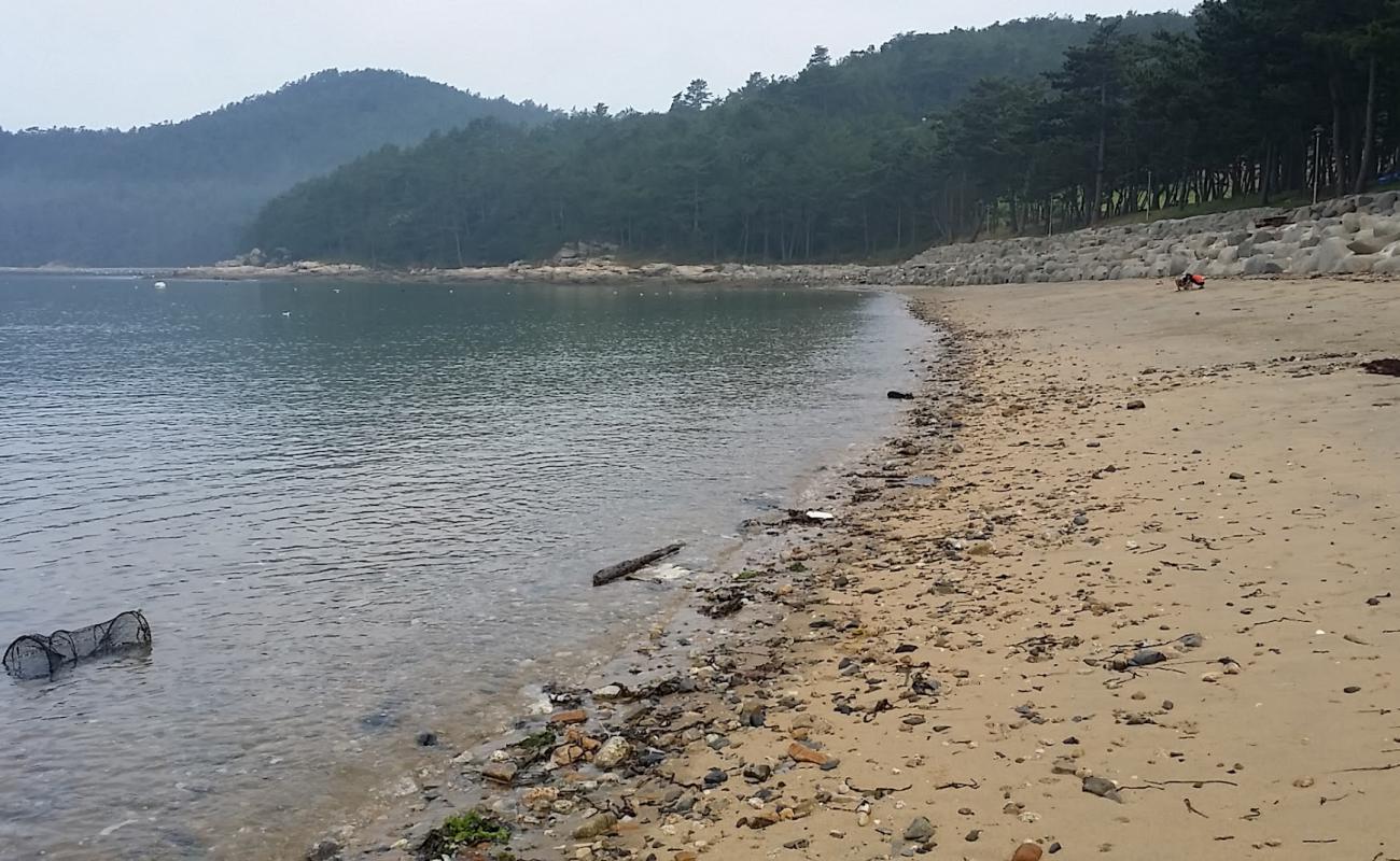 Photo of Yeonyeon Beach with bright sand & rocks surface