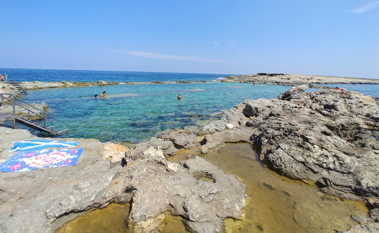 Photo of Qawra Point Beach with rocks cover surface