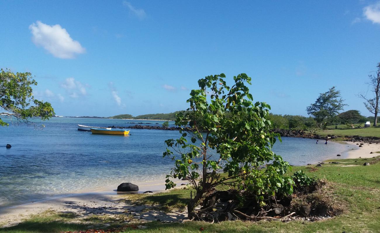 Photo of Le Bouchon Beach with bright sand & rocks surface