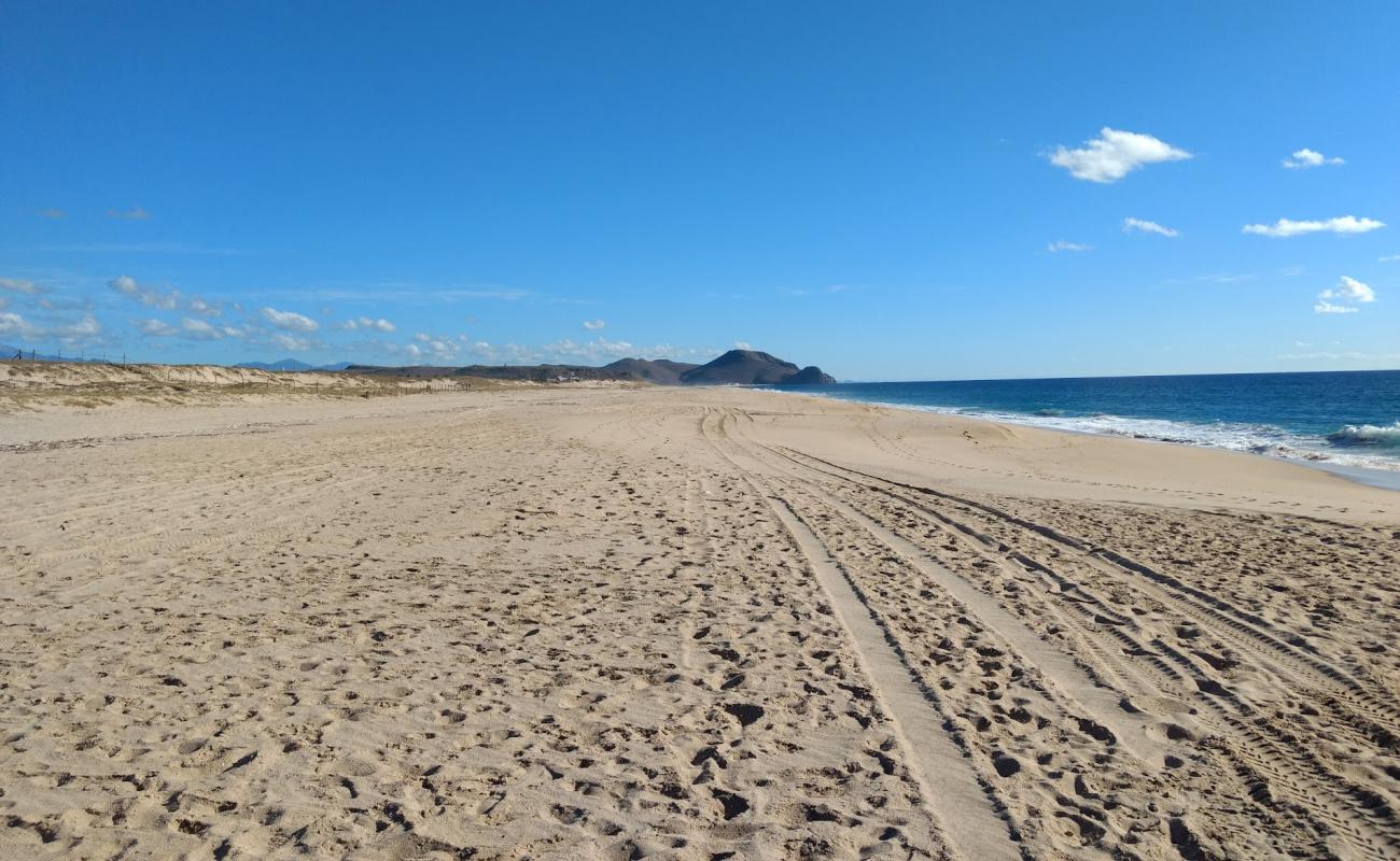 Photo of Playa Los Mangos with bright fine sand surface