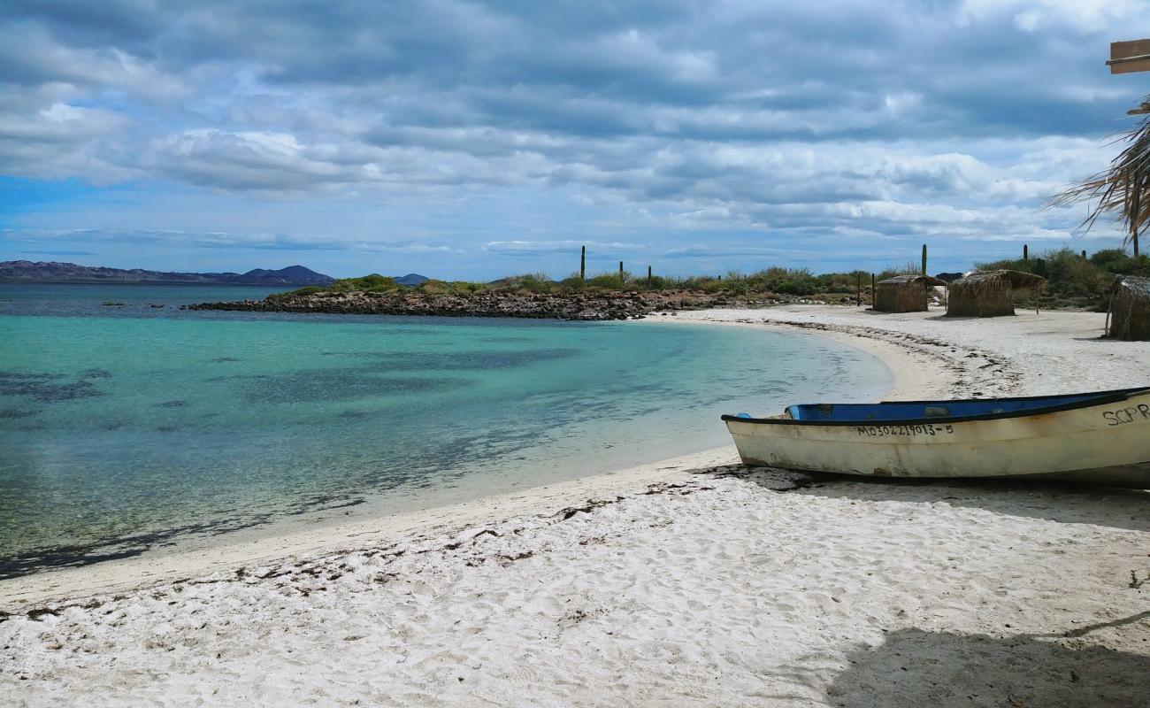 Photo of Playa La Perla with bright sand surface