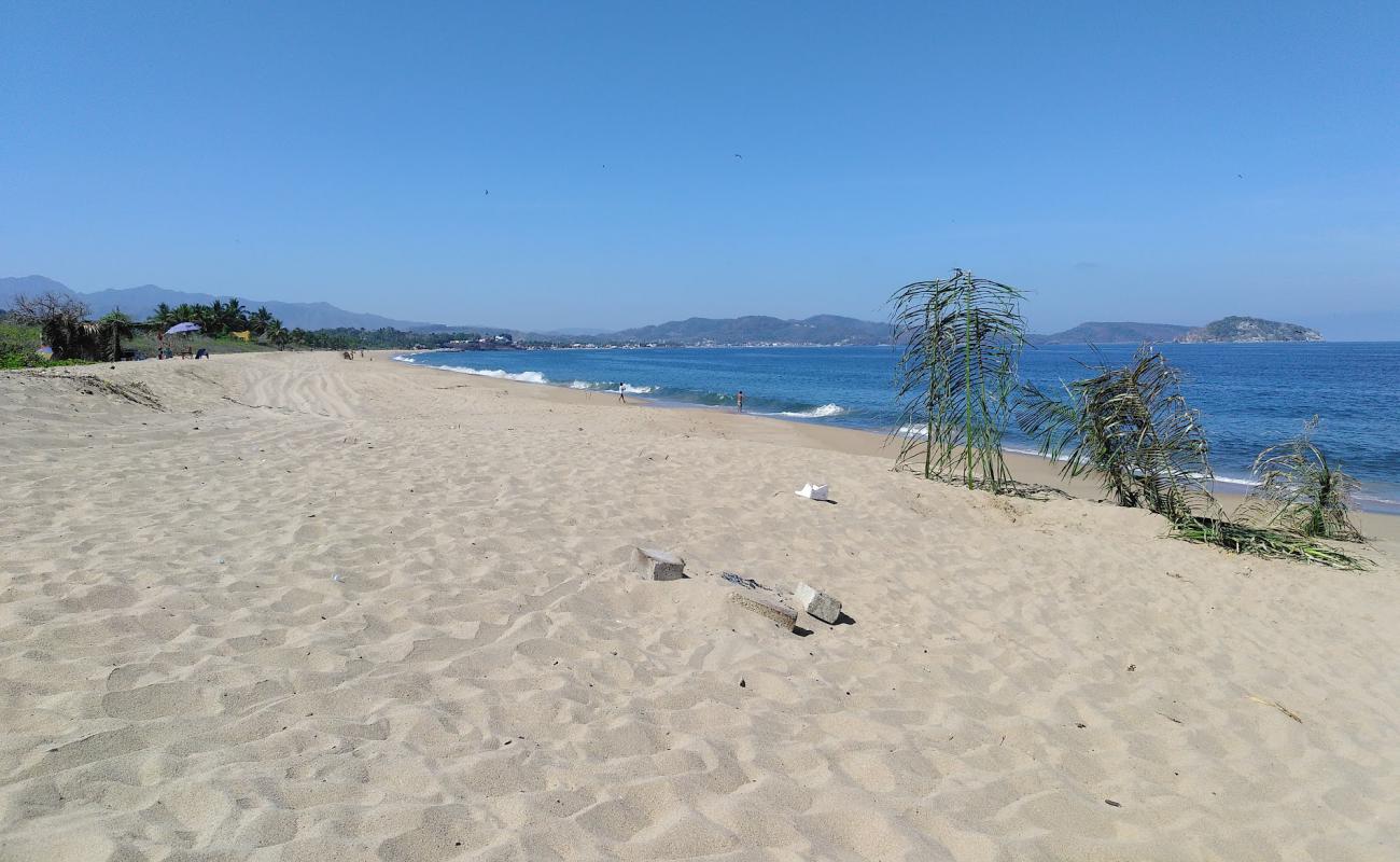 Photo of El Naranjo beach with bright fine sand surface