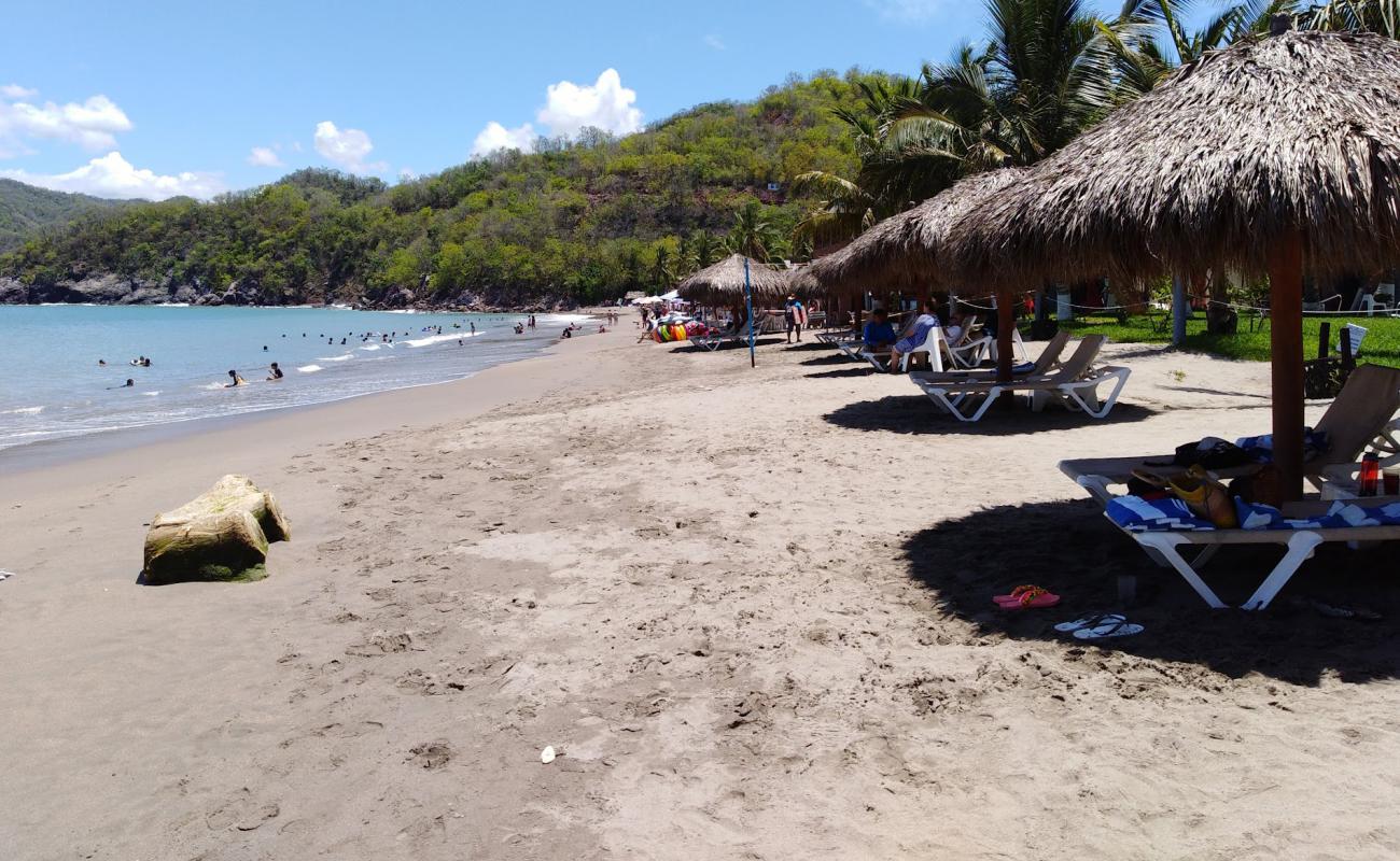 Photo of Playa Cuastecomates with brown fine sand surface