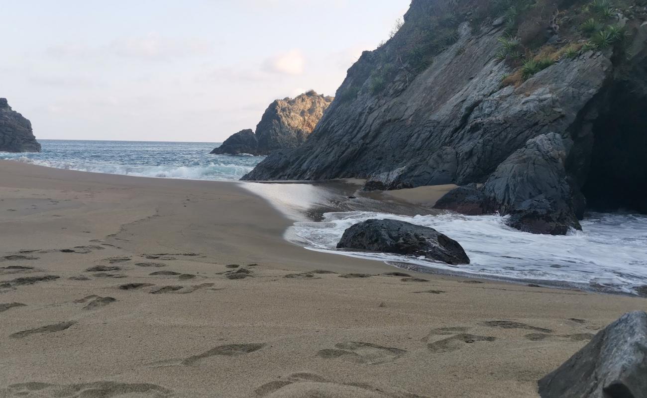 Photo of Playa Cocos with brown fine sand surface