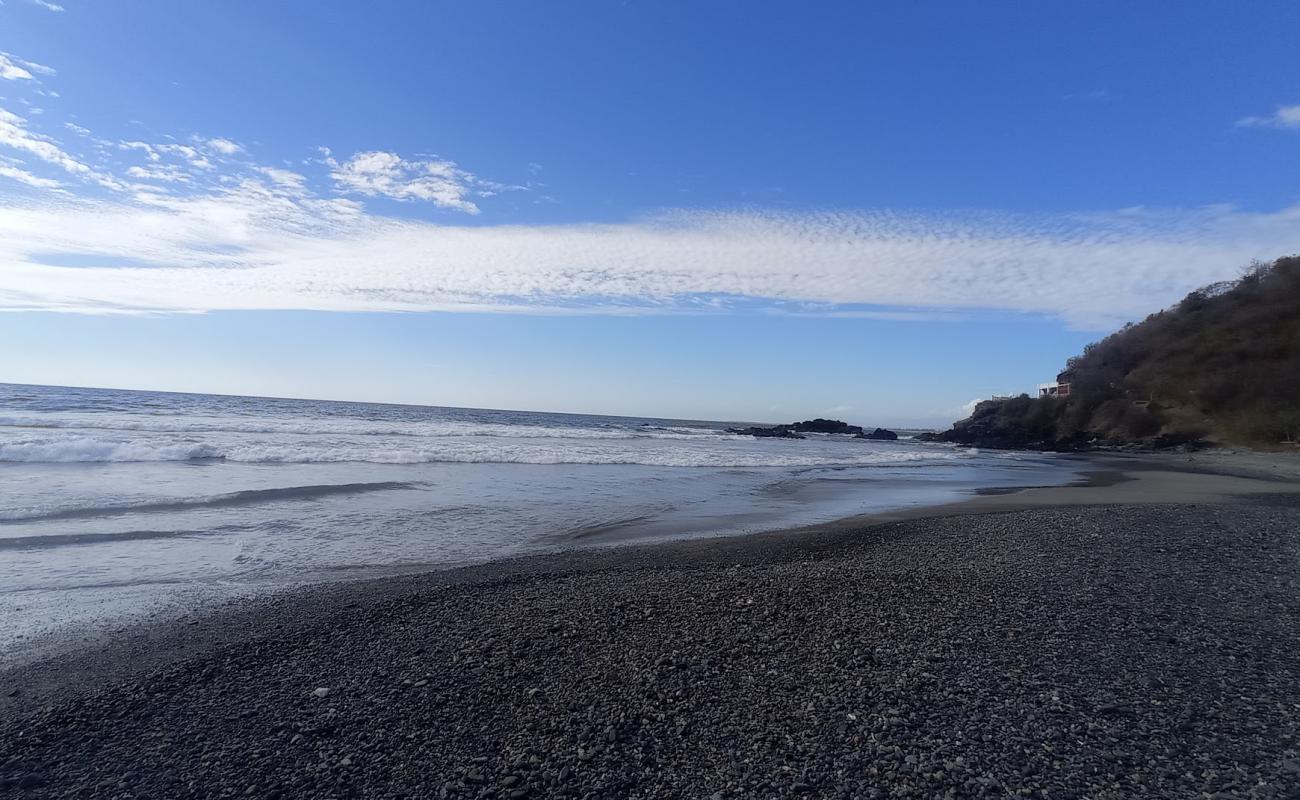 Photo of Tamarindillo beach with black sand & pebble surface