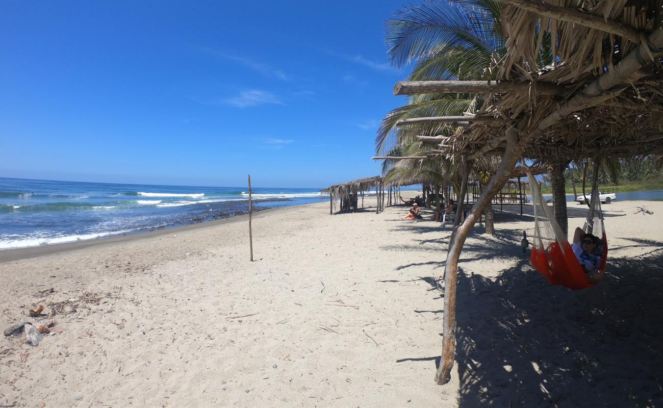 Photo of La Ticla Beach with brown sand surface