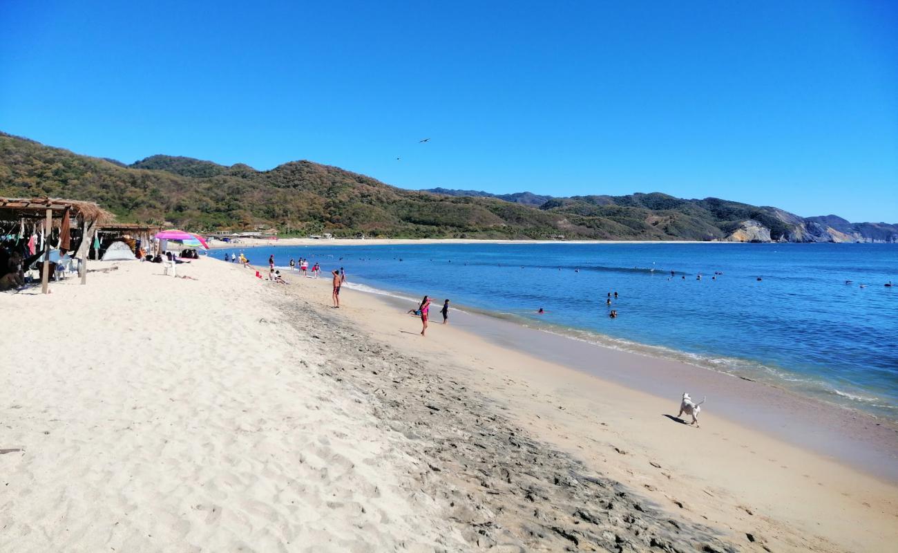 Photo of Playa Maruata with bright fine sand surface