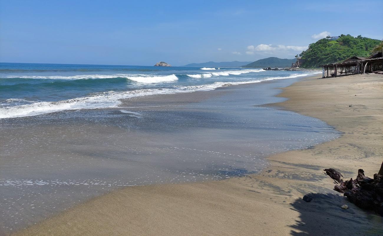 Photo of Playa Ojo De Agua with bright fine sand surface