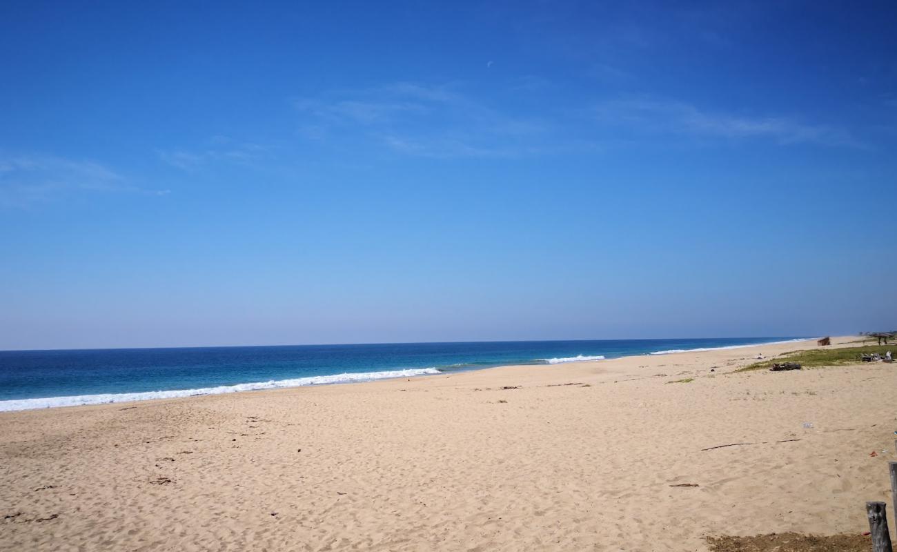 Photo of Playa Mitla with bright sand surface