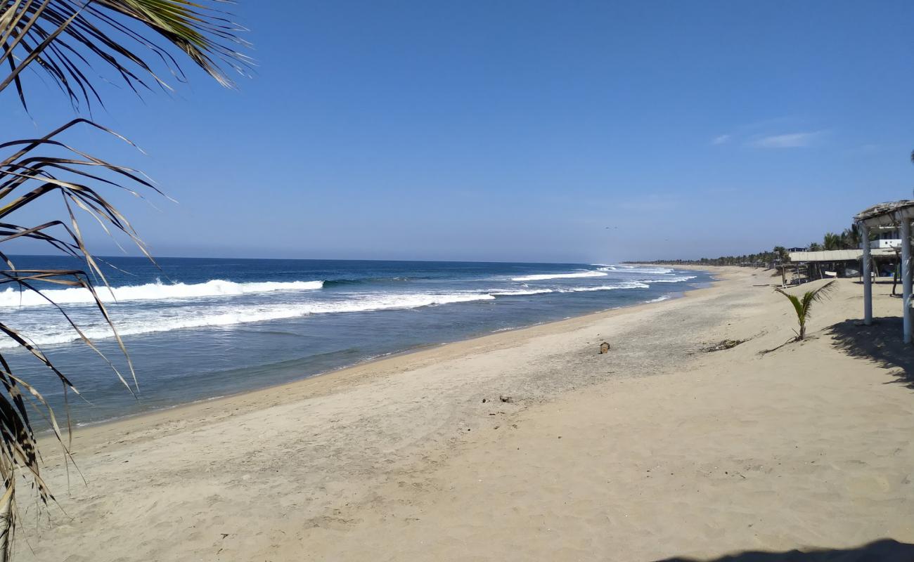 Photo of Playa Tomy with bright sand surface