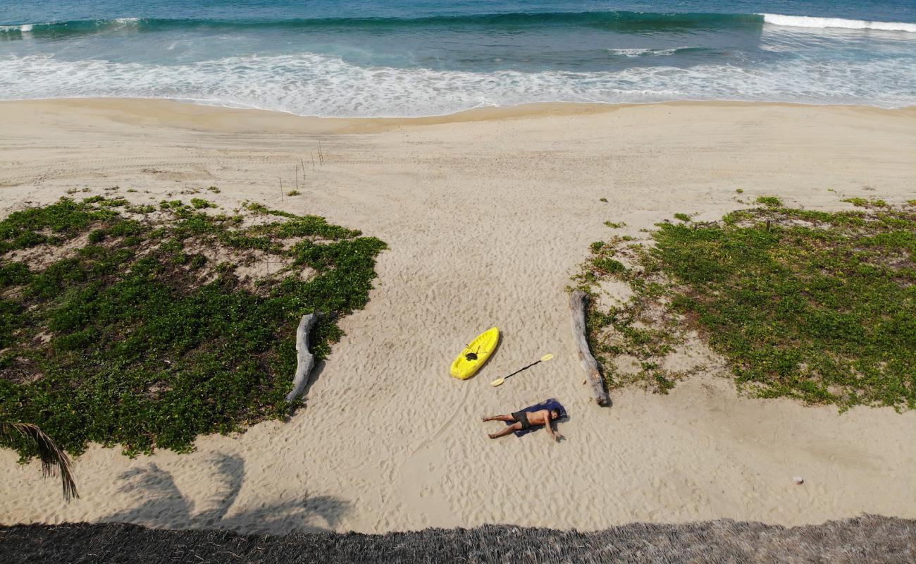 Photo of Playa Delfin with bright fine sand surface