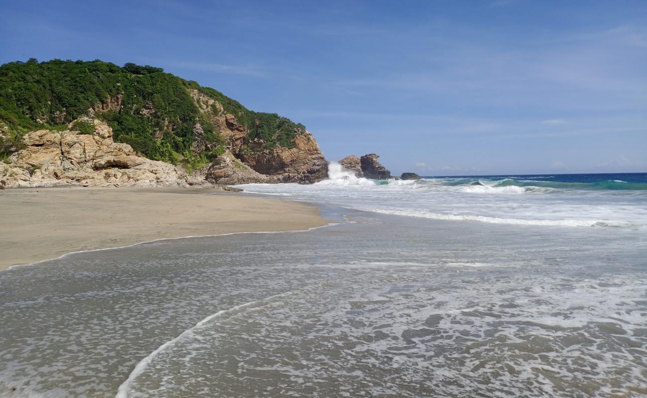 Photo of Playa La Ventanilla with gray fine sand surface