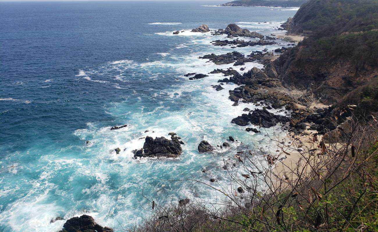 Photo of Arroyito beach with gray sand &  rocks surface