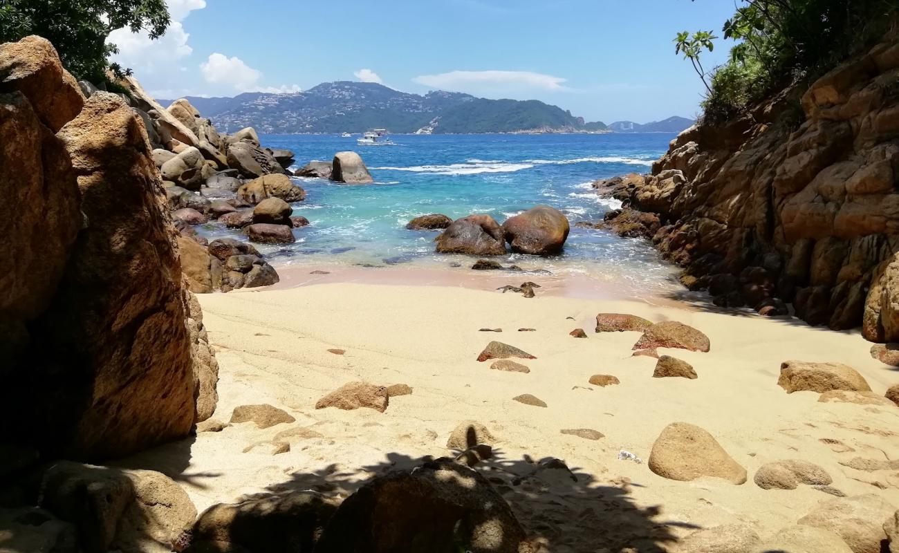 Photo of Roqueta Amor beach with bright sand & rocks surface