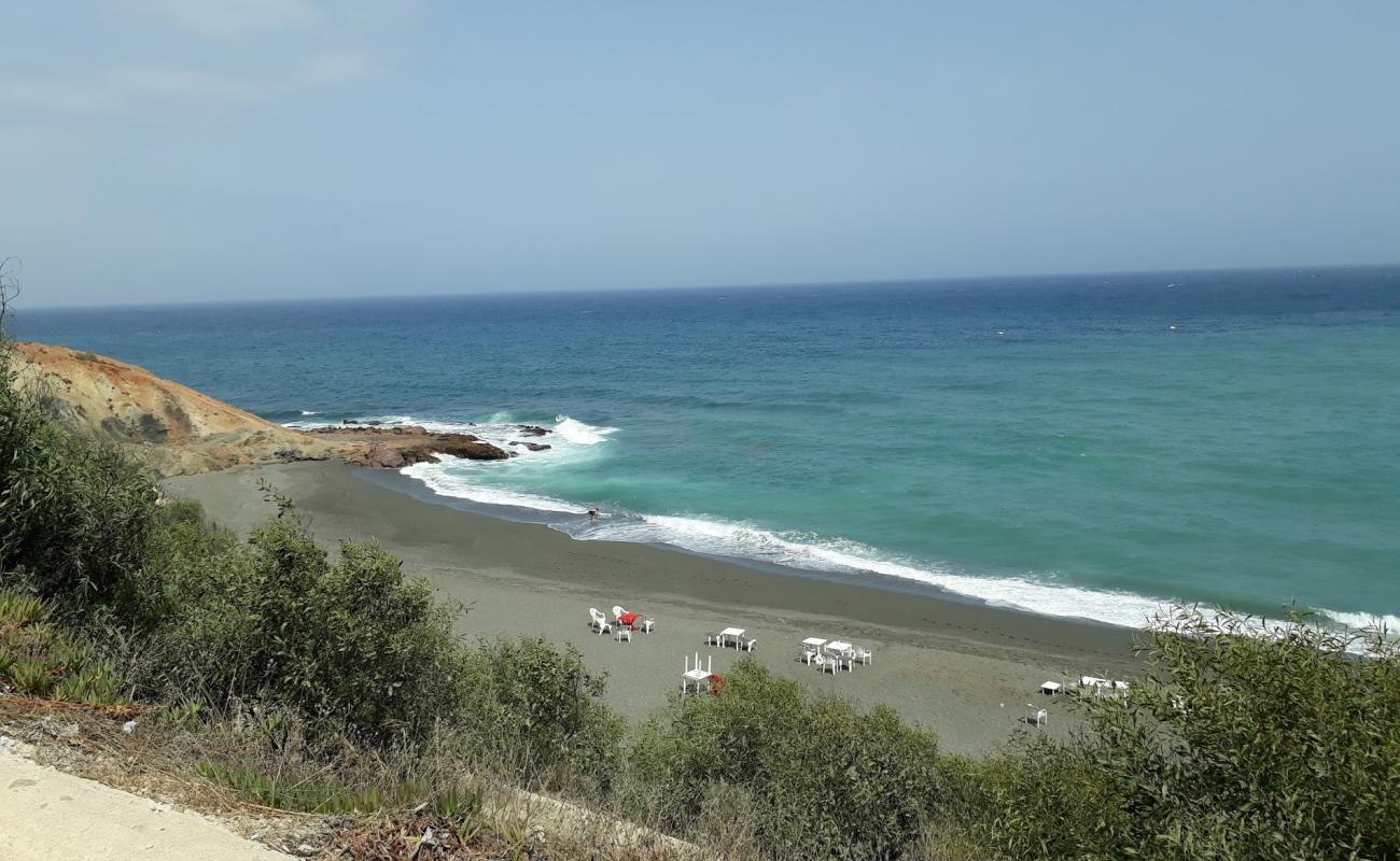 Photo of Plage Thara Youssef with black sand surface