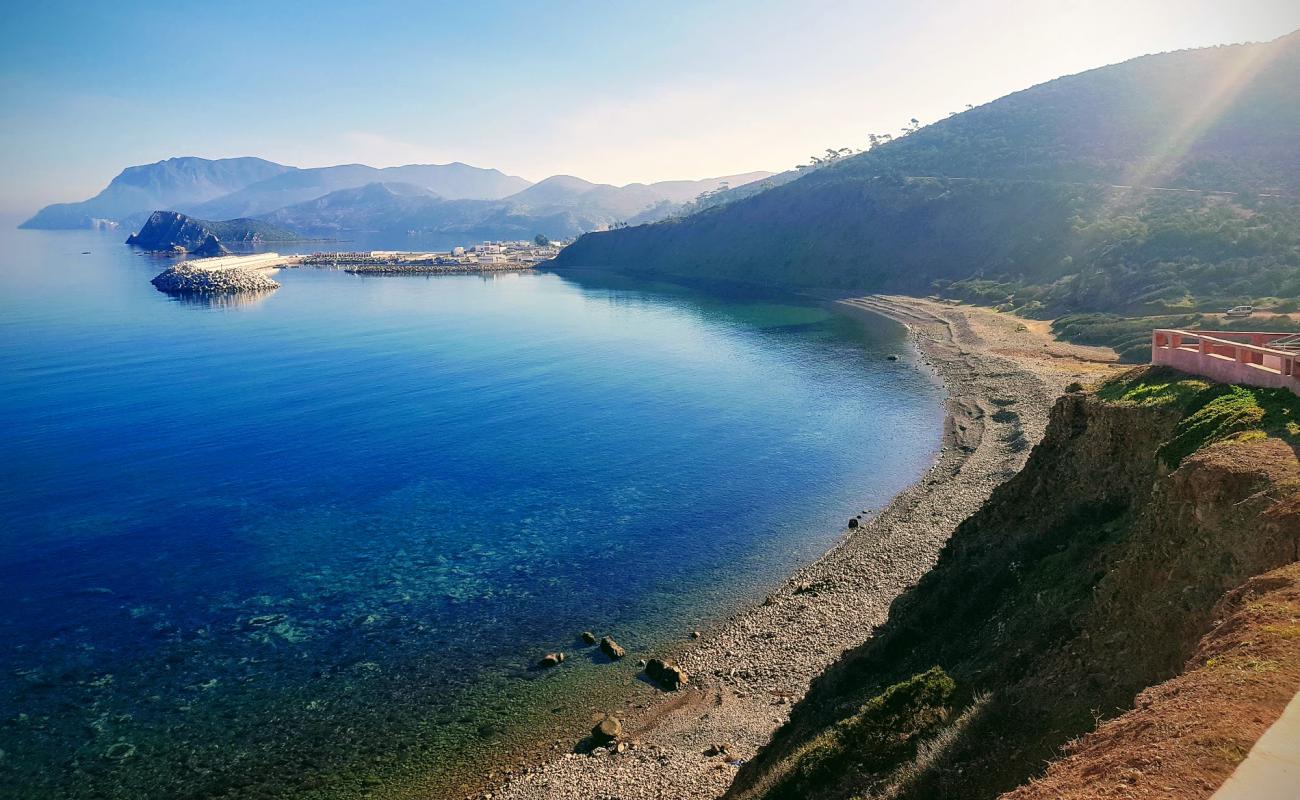 Photo of Almarsa Ighaniman with brown pebble surface