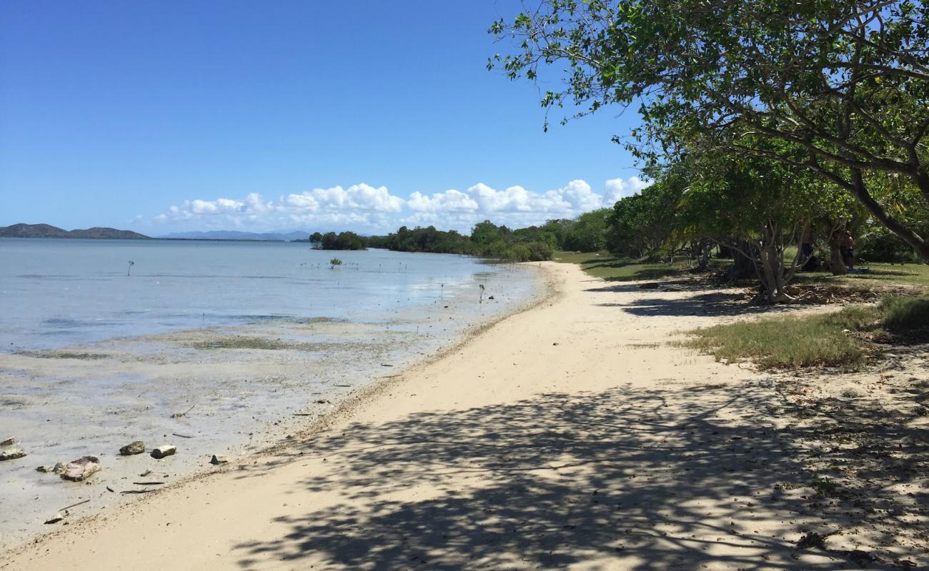 Photo of Ouano Beach with bright sand & rocks surface