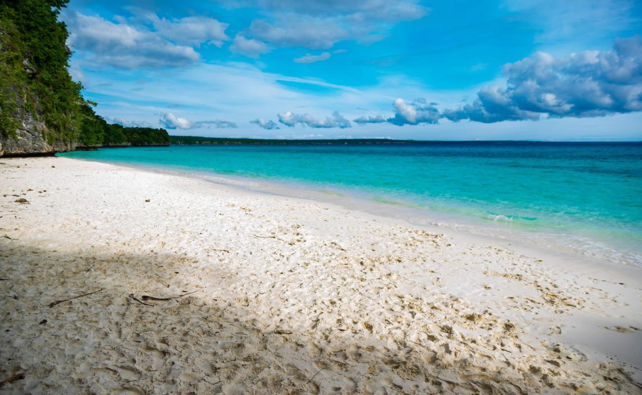 Photo of Kiki Beach with white fine sand surface