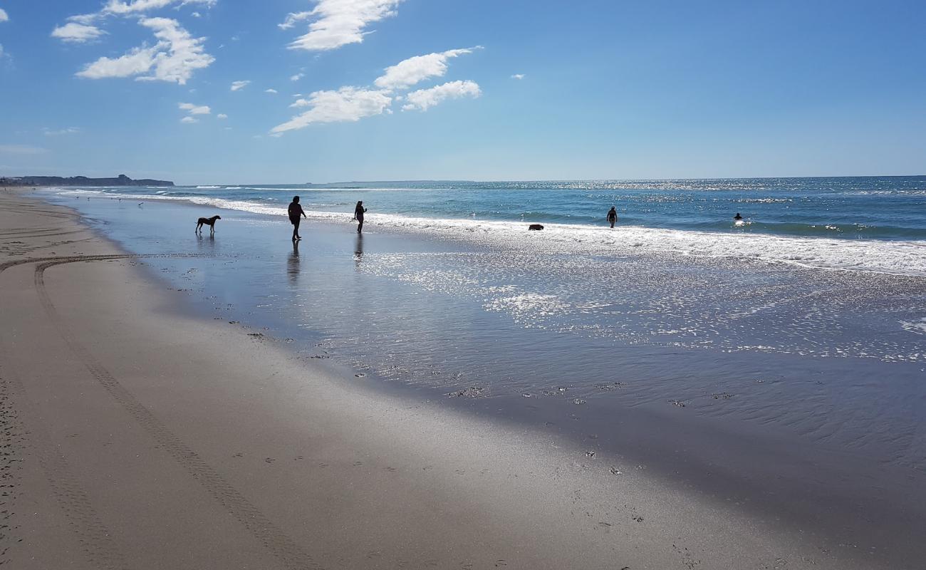 Photo of Poutuia Beach with bright sand surface