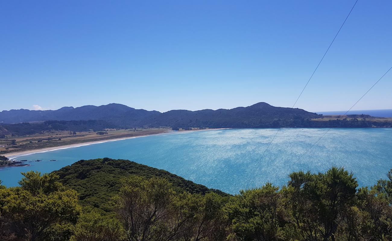 Photo of Hicks Bay with light sand &  pebble surface