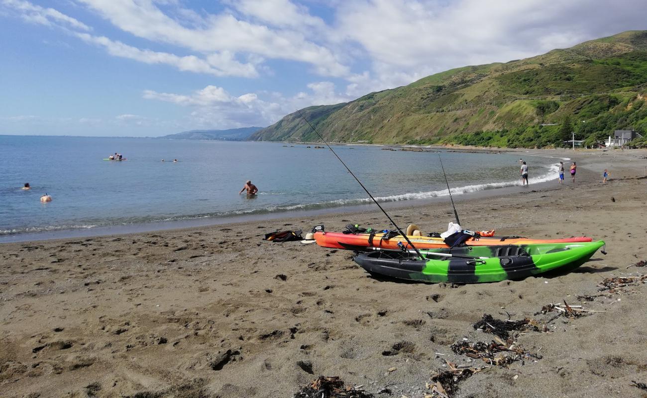 Photo of Pukerua Bay Beach with gray sand &  rocks surface