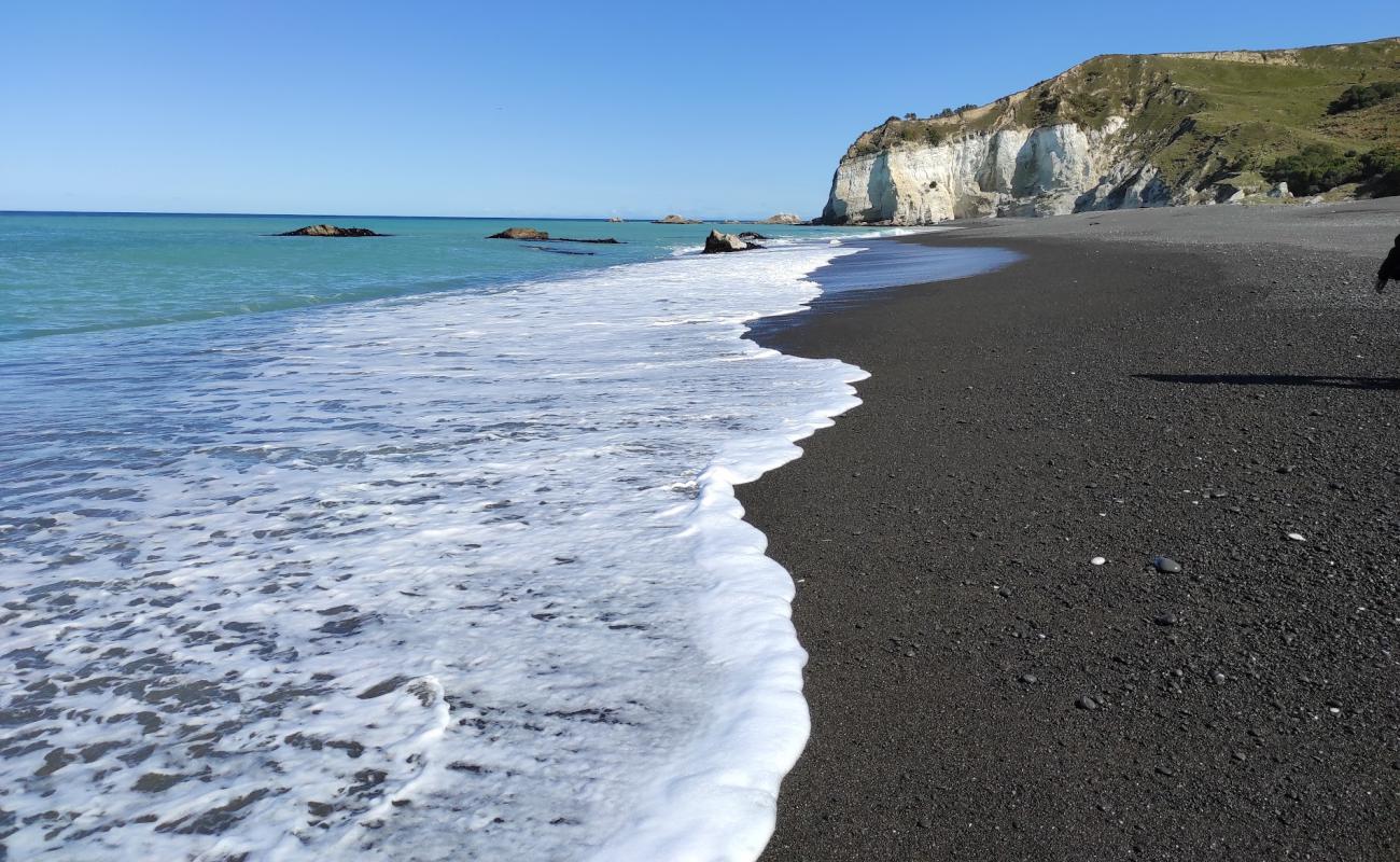 Photo of Nape Nape Beach with gray fine pebble surface