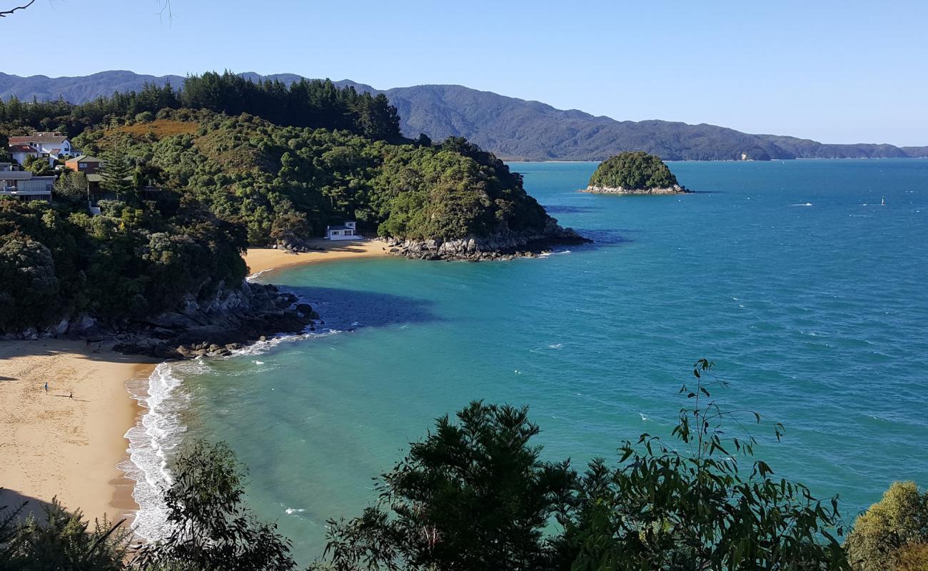 Photo of Honeymoon Bay Beach with bright fine sand surface