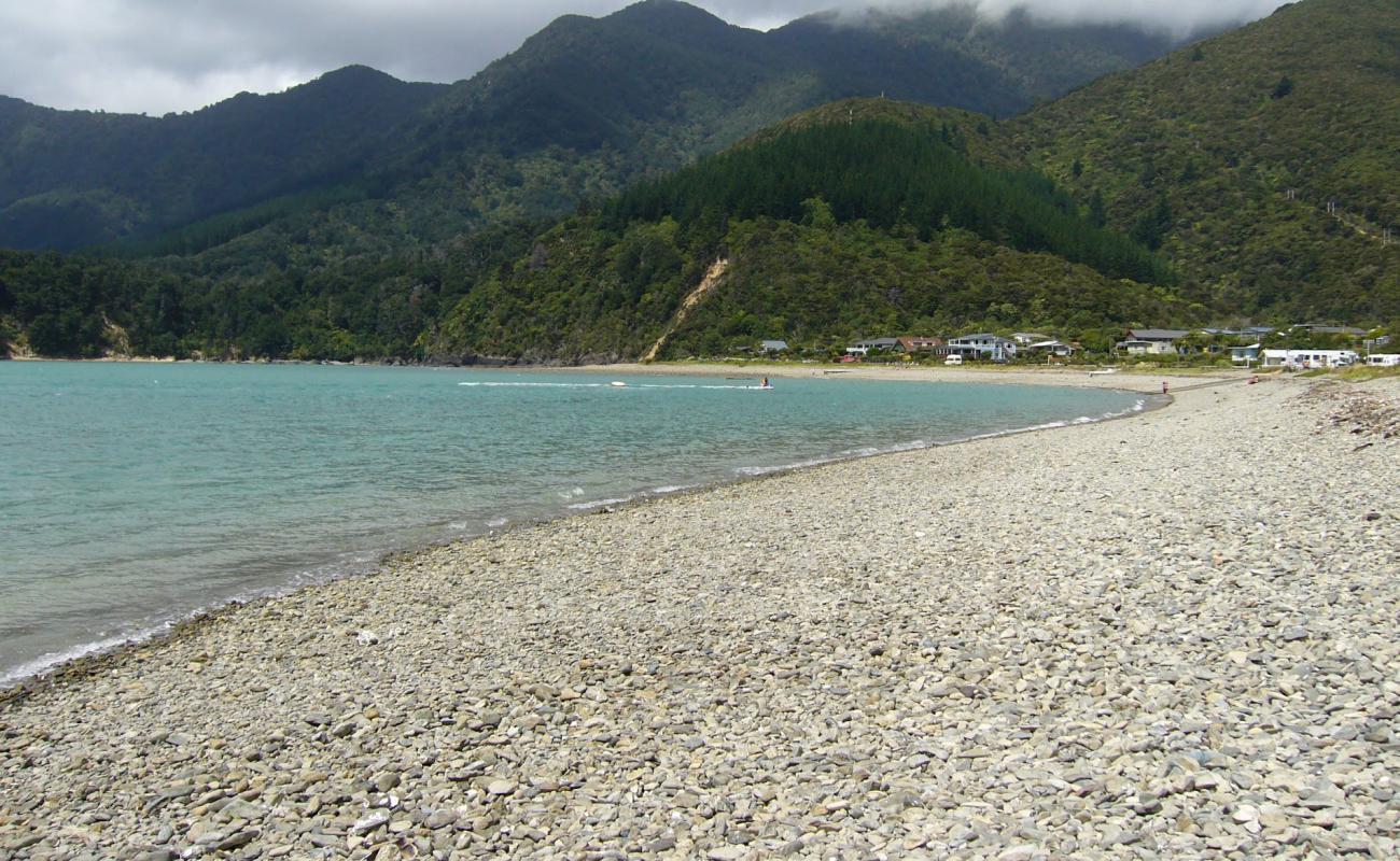 Photo of Okiwi Bay Beach with light fine pebble surface