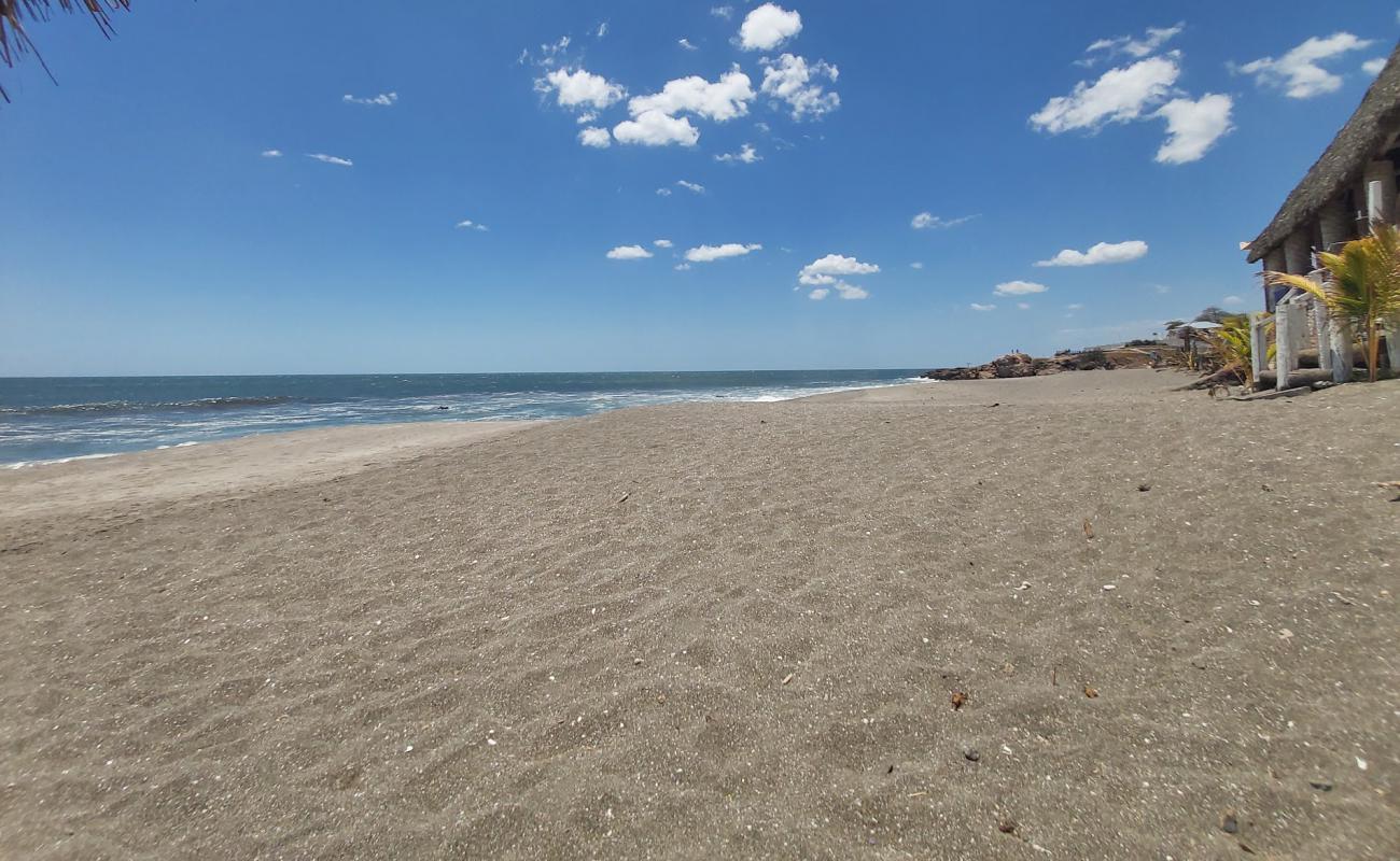 Photo of Las Penitas beach with gray sand surface