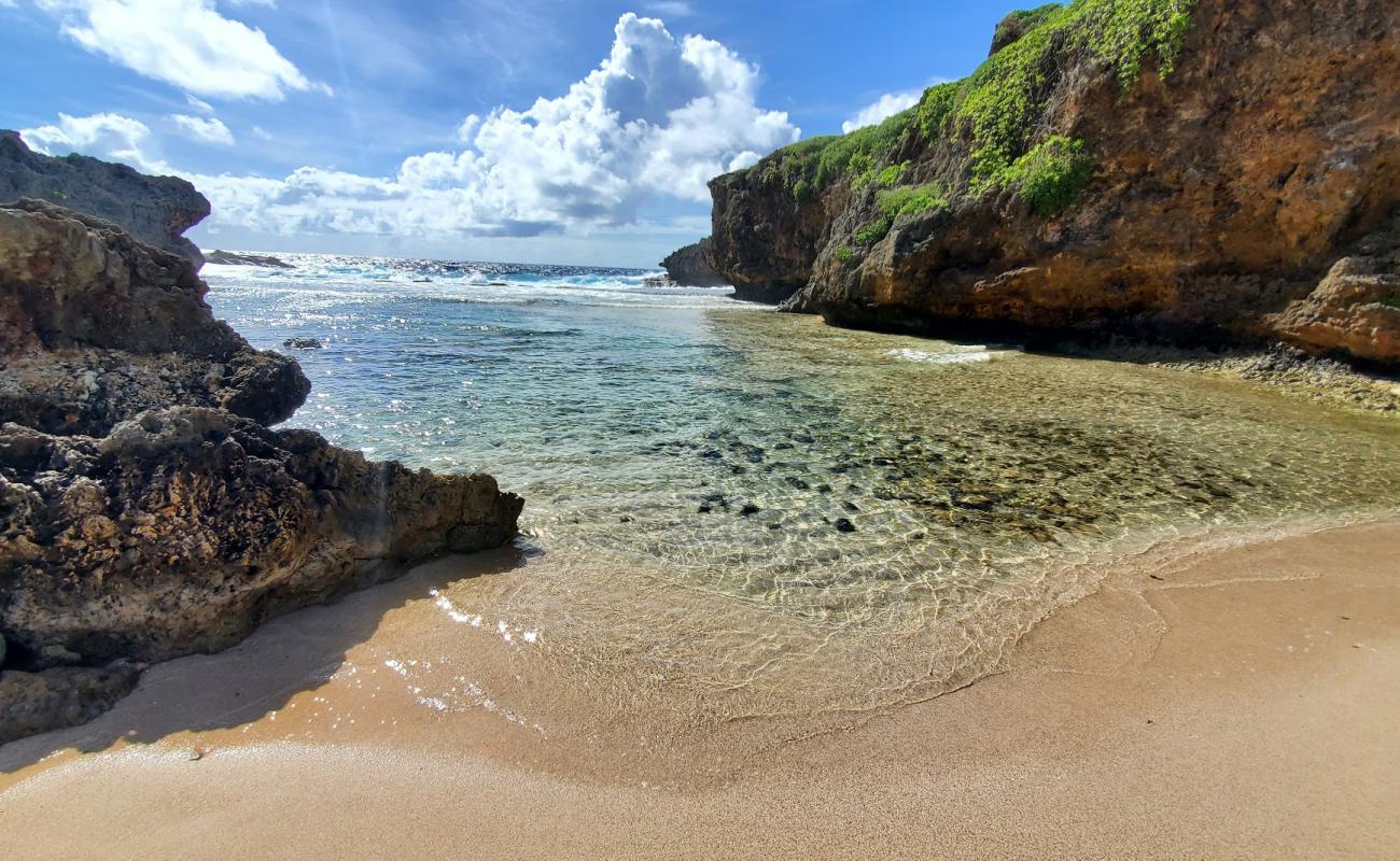 Photo of Old Man By The Sea with bright sand & rocks surface