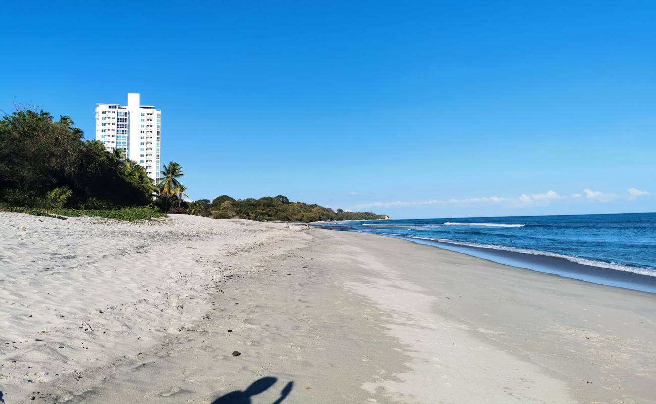 Photo of Corona Beach with gray sand surface